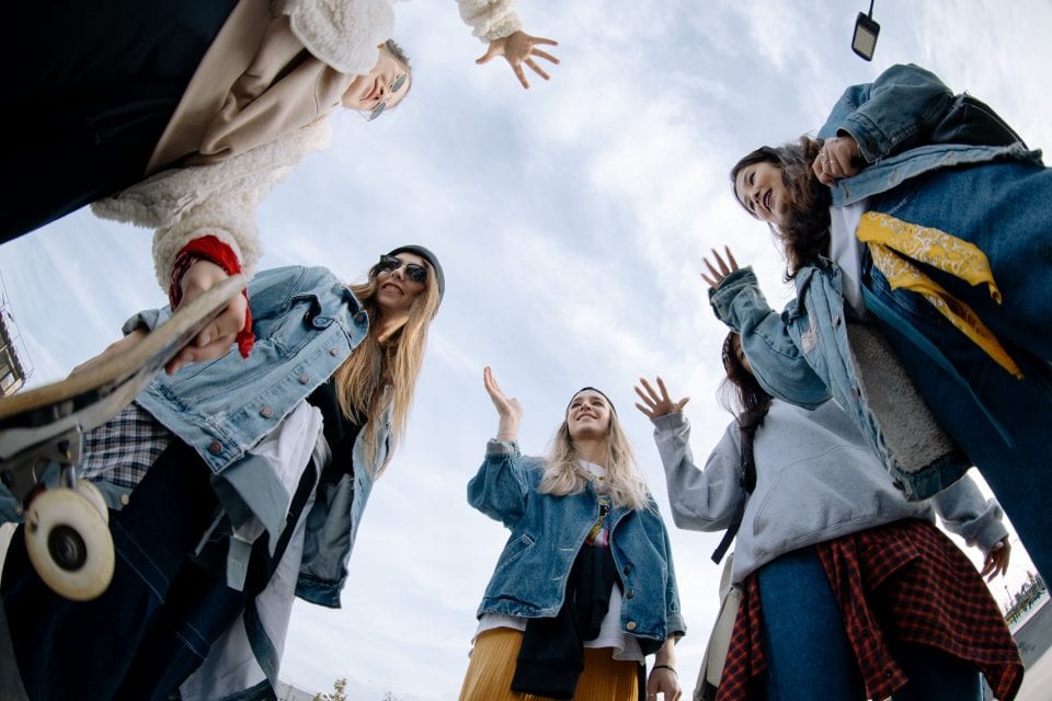A group of teenagers, seen from below.