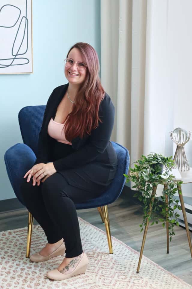 Kathie Lagacé sitting in a therapy office
