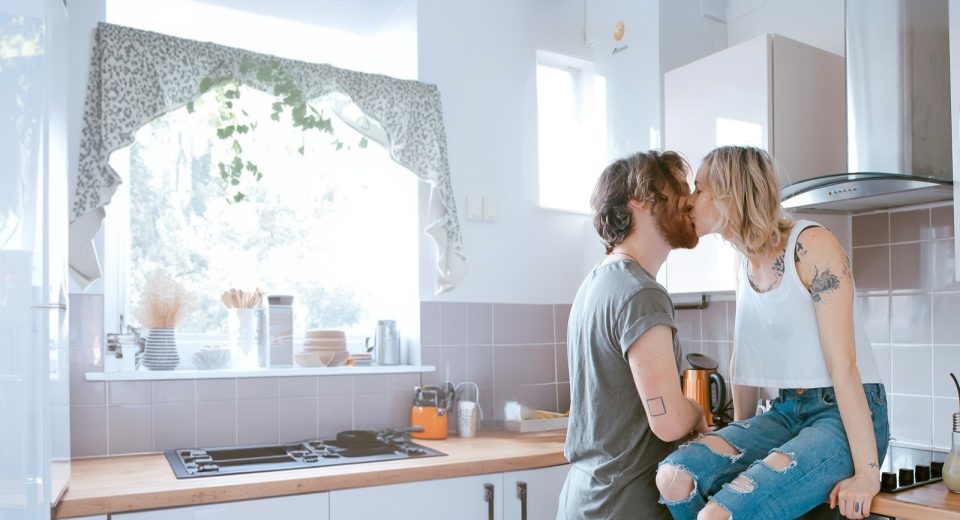 Couple kissing in the kitchen