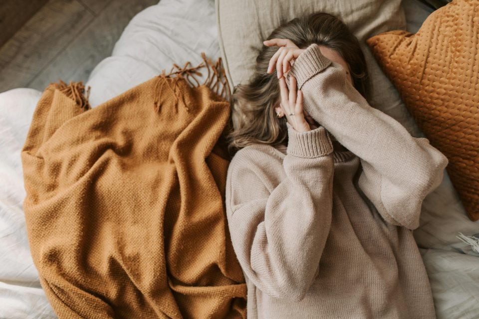 Woman covering face